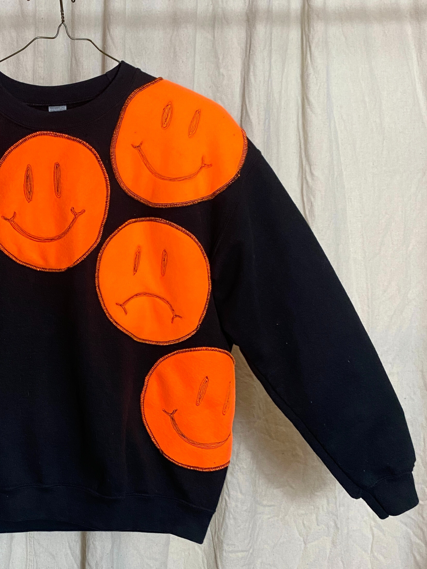 Moody Genderless Sweatshirt- Black Crewneck with Orange Fleece Patches of Smiley Faces